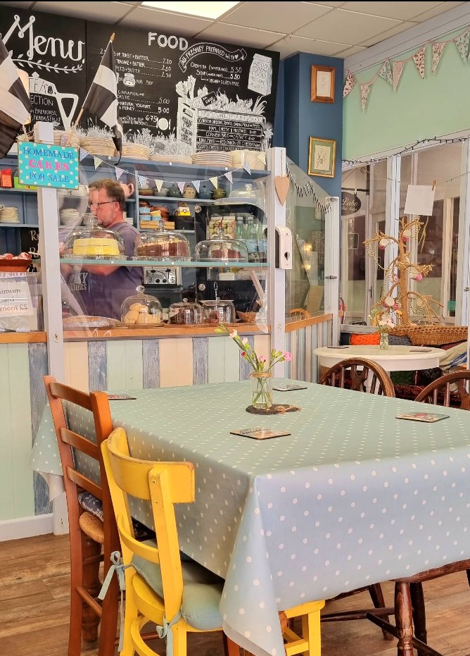 Tables and the cafe counter inside Cafe Art